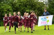 11 June 2021; Minister of State for Sport and the Gaeltacht Jack Chambers TD with 6th class pupils from his former school St. Brigid's National School at the Daily Mile launch at St. Brigid's National School, Beechpark Lawn, Castleknock in Dublin.  Photo by Matt Browne/Sportsfile