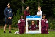 11 June 2021; Minister of State for Sport and the Gaeltacht Jack Chambers TD with 6th class pupils from his former school St. Brigid's National School, from left, Nero Arubayi, Phoebe Duncan, Aveen McDonnell, Jarlath O'Farrell and Sibbhant Raipal at the Daily Mile launch at St. Brigid's National School, Beechpark Lawn, Castleknock in Dublin.  Photo by Matt Browne/Sportsfile