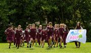 11 June 2021; Siena Lacey, right, of St. Brigid's National School holds the Daily Mile flag as her classmates run during the Daily Mile launch at St. Brigid's National School, Beechpark Lawn, Castleknock in Dublin.  Photo by Matt Browne/Sportsfile