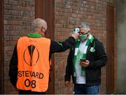 11 June 2021; A supporter has his temperature taken before the SSE Airtricity League Premier Division match between Shamrock Rovers and Finn Harps at Tallaght Stadium in Dublin. The game is one of the first of a number of pilot sports events over the coming weeks which are implementing guidelines set out by the Irish government to allow for the safe return of spectators to sporting events. Photo by Stephen McCarthy/Sportsfile
