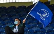 11 June 2021; Leinster 'supporter' James Lowe from New Zealand waves his flag in the stands during the Guinness PRO14 match between Leinster and Dragons at RDS Arena in Dublin. The game is one of the first of a number of pilot sports events over the coming weeks which are implementing guidelines set out by the Irish government to allow for the safe return of spectators to sporting events. Photo by Brendan Moran/Sportsfile