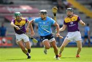 12 June 2021; Cian Boland of Dublin in action against Shaun Murphy and Diarmuid O'Keeffe of Wexford during the Allianz Hurling League Division 1 Round 5 match between Wexford and Dublin at Chadwicks Wexford Park in Wexford. Photo by Matt Browne/Sportsfile