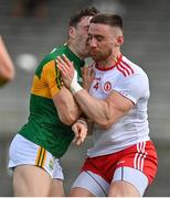12 June 2021; Paudie Clifford of Kerry is injured in a challenge with Padraig Hampsey of Tyrone during the Allianz Football League Division 1 semi-final match between Kerry and Tyrone at Fitzgerald Stadium in Killarney, Kerry. Photo by Brendan Moran/Sportsfile