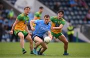 12 June 2021; Con O'Callaghan of Dublin in action against Hugh McFadden, left, and Brendan McCole of Donegal during the Allianz Football League Division 1 semi-final match between Donegal and Dublin at Kingspan Breffni Park in Cavan. Photo by Stephen McCarthy/Sportsfile