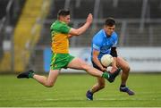 12 June 2021; Eric Lowndes of Dublin in action against Conor O'Donnell of Donegal during the Allianz Football League Division 1 semi-final match between Donegal and Dublin at Kingspan Breffni Park in Cavan. Photo by Stephen McCarthy/Sportsfile
