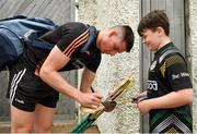 13 June 2021; Young Limerick supporter Ciarán Casserly, age 11, from Mullingar, Westmeath, has his hurl signed by Limerick's Gearoid Hegarty before the Allianz Hurling League Division 1 Group A Round 5 match between Westmeath and Limerick at TEG Cusack Park in Mullingar, Westmeath. Photo by Seb Daly/Sportsfile