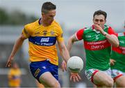 13 June 2021; Eoin Cleary of Clare in action against Paddy Durcan of Mayo during the Allianz Football League Division 2 semi-final match between Clare and Mayo at Cusack Park in Ennis, Clare. Photo by Brendan Moran/Sportsfile