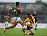 13 June 2021; Cian O'Dea of Clare in action against Tommy Conroy of Mayo during the Allianz Football League Division 2 semi-final match between Clare and Mayo at Cusack Park in Ennis, Clare. Photo by Brendan Moran/Sportsfile