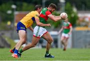 13 June 2021; Aidan O'Shea of Mayo is tackled by Cathal O'Connor of Clare during the Allianz Football League Division 2 semi-final match between Clare and Mayo at Cusack Park in Ennis, Clare. Photo by Brendan Moran/Sportsfile
