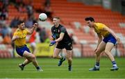 13 June 2021; Armagh goalkeeper Blaine Hughes in action against Ciarán Murtagh, left, and Tadhg O'Rourke of Roscommon during the Allianz Football League Division 1 Relegation play-off match between Armagh and Roscommon at Athletic Grounds in Armagh. Photo by Ramsey Cardy/Sportsfile