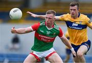 13 June 2021; Ryan O'Donoghue of Mayo in action against Ciaran Russell of Clare during the Allianz Football League Division 2 semi-final match between Clare and Mayo at Cusack Park in Ennis, Clare. Photo by Brendan Moran/Sportsfile