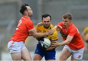 13 June 2021; Donie Smith of Roscommon under pressure from Ross Finn, left, and Oisin O'Neill of Armagh during the Allianz Football League Division 1 Relegation play-off match between Armagh and Roscommon at Athletic Grounds in Armagh. Photo by Ramsey Cardy/Sportsfile
