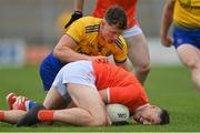 13 June 2021; Aaron McKay of Armagh is tackled by Conor Cox of Roscommon during the Allianz Football League Division 1 Relegation play-off match between Armagh and Roscommon at Athletic Grounds in Armagh. Photo by Ramsey Cardy/Sportsfile