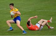 13 June 2021; Richard Hughes of Roscommon evades a tackle by Ciaron O'Hanlon of Armagh during the Allianz Football League Division 1 Relegation play-off match between Armagh and Roscommon at Athletic Grounds in Armagh. Photo by Ramsey Cardy/Sportsfile