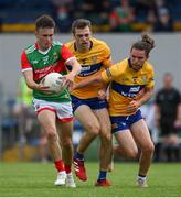 13 June 2021; Paul Towey of Mayo in action against Cillian Brennan and Cian O'Dea of Clare during the Allianz Football League Division 2 semi-final match between Clare and Mayo at Cusack Park in Ennis, Clare. Photo by Brendan Moran/Sportsfile
