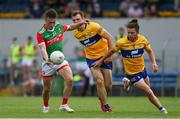 13 June 2021; Paul Towey of Mayo in action against Cillian Brennan and Cian O'Dea of Clare during the Allianz Football League Division 2 semi-final match between Clare and Mayo at Cusack Park in Ennis, Clare. Photo by Brendan Moran/Sportsfile