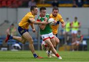 13 June 2021; Paul Towey of Mayo in action against Cillian Brennan and Cian O'Dea of Clare during the Allianz Football League Division 2 semi-final match between Clare and Mayo at Cusack Park in Ennis, Clare. Photo by Brendan Moran/Sportsfile