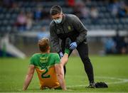 12 June 2021; Stephen McMenamin of Donegal receives medical attention from Donegal physiotherapist Cathal Ellis during the Allianz Football League Division 1 semi-final match between Donegal and Dublin at Kingspan Breffni Park in Cavan. Photo by Stephen McCarthy/Sportsfile