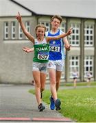 12 June 2021; Savanagh O'Callaghan of Tuam AC celebrates as she crosses the line to win the 2km walk, from second place Sean Kelleher of South Galway AC, during the Irish Life Health National 20k Walks Championships at St Jarlath’s College in Tuam, Galway. Photo by Seb Daly/Sportsfile