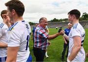 13 June 2021; Monaghan players are congratulated by the suspended Monaghan manager Seamus McEnaney, who was at the game as a spectator, after the Allianz Football League Division 1 Relegation play-off match between Monaghan and Galway at St. Tiernach’s Park in Clones, Monaghan. Photo by Ray McManus/Sportsfile