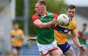 13 June 2021; Ryan O'Donoghue of Mayo in action against Ciaran Russell of Clare during the Allianz Football League Division 2 semi-final match between Clare and Mayo at Cusack Park in Ennis, Clare. Photo by Brendan Moran/Sportsfile