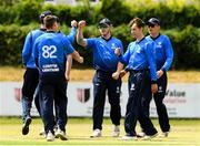 18 June 2021; Jamie Grassi of Leinster Lightning is congratulated by his team-mates after taking a catch from Tyrone Kane of Munster Reds during the Cricket Ireland InterProvincial Trophy 2021 match between Leinster Lightning and Munster Reds at Pembroke Cricket Club in Dublin. Photo by Matt Browne/Sportsfile
