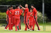 18 June 2021; Aaron Cawley of Munster Reds is congratulated by his team-mates after taking the wicket of Kevin O'Brien of Leinster Lightning during the Cricket Ireland InterProvincial Trophy 2021 match between Leinster Lightning and Munster Reds at Pembroke Cricket Club in Dublin. Photo by Matt Browne/Sportsfile