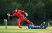 18 June 2021; Lorcan Tucker of Leinster Lightning dives to make the wicket before PJ Moor of Munster Reds can take him out during the Cricket Ireland InterProvincial Trophy 2021 match between Leinster Lightning and Munster Reds at Pembroke Cricket Club in Dublin. Photo by Matt Browne/Sportsfile