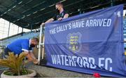 18 June 2021; Waterford supporter Martin O'Callaghan, left, sets up his flag, watched by son Brandon before their side's SSE Airtricity League Premier Division match against Shamrock Rovers at the RSC in Waterford. Photo by Seb Daly/Sportsfile