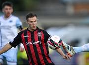 18 June 2021; Liam Burt of Bohemians has the ball kicked away from him by Mark Doyle of Drogheda United during the SSE Airtricity League Premier Division match between Bohemians and Drogheda United at Dalymount Park in Dublin. Photo by Piaras Ó Mídheach/Sportsfile