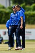 19 June 2021; David O'Halloran of Leinster Lightning, right, is congratulated by team-mate George Dockrell after claiming the wicket of Northern Knights' Harry Tector during the Cricket Ireland InterProvincial Trophy 2021 match between Leinster Lightning and Northern Knights at Pembroke Cricket Club in Dublin. Photo by Seb Daly/Sportsfile
