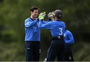 19 June 2021; George Dockrell, left, and Lorcan Tucker of Leinster Lightning congratulate each other after claiming the wicket of Northern Knights' Ruhan Pretorius during the Cricket Ireland InterProvincial Trophy 2021 match between Leinster Lightning and Northern Knights at Pembroke Cricket Club in Dublin. Photo by Seb Daly/Sportsfile