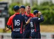 19 June 2021; Graeme McCarter of Northern Knights celebrates with team-mates after claiming the wicket of Leinster Lightning's Kevin O'Brien, caught by team-mate Ross Adair, during the Cricket Ireland InterProvincial Trophy 2021 match between Leinster Lightning and Northern Knights at Pembroke Cricket Club in Dublin. Photo by Seb Daly/Sportsfile