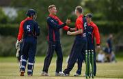 19 June 2021; Ben White of Northern Knights, centre, is congratulated by team-mates after claiming the wicket of Leinster Lightning's Tim Tector during the Cricket Ireland InterProvincial Trophy 2021 match between Leinster Lightning and Northern Knights at Pembroke Cricket Club in Dublin. Photo by Seb Daly/Sportsfile