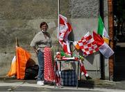 19 June 2021; A flagseller awaits customers on St. James Avenue before the Allianz Football League Division 3 Final match between Derry and Offaly at Croke Park in Dublin. Photo by Ray McManus/Sportsfile