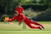 19 June 2021; Matt Ford of Munster Reds attempts to field the ball during the Cricket Ireland InterProvincial Trophy 2021 match between Munster Reds and North West Warriors at Pembroke Cricket Club in Dublin. Photo by Seb Daly/Sportsfile