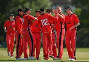 19 June 2021; Aaron Cawley of Munster Reds, second from right, is congratulated by team-mates after bowling Nathan McGuire of North West Warriors during the Cricket Ireland InterProvincial Trophy 2021 match between Munster Reds and North West Warriors at Pembroke Cricket Club in Dublin. Photo by Seb Daly/Sportsfile