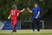 19 June 2021; Shane Getkate of North West Warriors and Matt Ford of Munster Reds following the Cricket Ireland InterProvincial Trophy 2021 match between between Munster Reds and North West Warriors at Pembroke Cricket Club in Dublin. Photo by Seb Daly/Sportsfile