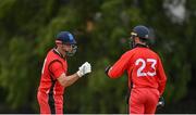 19 June 2021; Munster Reds' Fionn Hand, left, and Murray Commins during the Cricket Ireland InterProvincial Trophy 2021 match between between Munster Reds and North West Warriors at Pembroke Cricket Club in Dublin. Photo by Seb Daly/Sportsfile