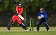 19 June 2021; Murray Commins of Munster Reds plays a shot, watched by North West Warriors wicketkeeper Stephen Doheny, during the Cricket Ireland InterProvincial Trophy 2021 match between between Munster Reds and North West Warriors at Pembroke Cricket Club in Dublin. Photo by Seb Daly/Sportsfile