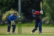 19 June 2021; Ruhan Pretorius of Northern Knights plays a shot, watched by Leinster Lightning wicketkeeper Lorcan Tucker during the Cricket Ireland InterProvincial Trophy 2021 match between between Leinster Lightning and Northern Knights at Pembroke Cricket Club in Dublin. Photo by Seb Daly/Sportsfile