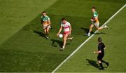 19 June 2021; Referee Seán Lonergan close to the action as Shane McGuigan of Derry races clear of Offaly pair Colm Doyle left, and Peter Cunningham during the Allianz Football League Division 3 Final match between between Derry and Offaly at Croke Park in Dublin. Photo by Ray McManus/Sportsfile