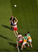 19 June 2021; Conor Glass of Derry jumps highest to win possession as referee Seán Lonergan starts the second half of the Allianz Football League Division 3 Final match between between Derry and Offaly at Croke Park in Dublin. Photo by Ray McManus/Sportsfile
