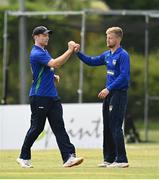 20 June 2021; Shane Getkate, left, and Ross Allen of North West Warriors celebrate the wicket of George Dockrell of Leinster Lightning during the Cricket Ireland InterProvincial Trophy 2021 match between Leinster Lightning and North West Warriors at Pembroke Cricket Club in Dublin. Photo by Harry Murphy/Sportsfile