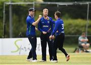 20 June 2021; North West Warriors players, from left, Shane Getkate, Ross Allen and Andy McBrine celebrate the wicket of George Dockrell of Leinster Lightning during the Cricket Ireland InterProvincial Trophy 2021 match between Leinster Lightning and North West Warriors at Pembroke Cricket Club in Dublin. Photo by Harry Murphy/Sportsfile