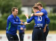 20 June 2021; Kyle Magee of North West Warriors, centre, celebrates a wicket with Andy McBrine and Craig Young during the Cricket Ireland InterProvincial Trophy 2021 match between Leinster Lightning and North West Warriors at Pembroke Cricket Club in Dublin. Photo by Harry Murphy/Sportsfile