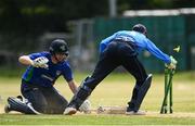 20 June 2021; Craig Young of North West Warriors dives in to win the match between despite the run out attempt of Lorcan Tucker of Leinster Lightning during the Cricket Ireland InterProvincial Trophy 2021 match between Leinster Lightning and North West Warriors at Pembroke Cricket Club in Dublin. Photo by Harry Murphy/Sportsfile