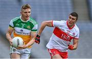 19 June 2021; David Dempsey of Offaly in action against Ciarán McFaul of Derry during the Allianz Football League Division 3 Final match between Derry and Offaly at Croke Park in Dublin. Photo by Piaras Ó Mídheach/Sportsfile