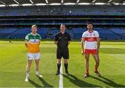 19 June 2021; Referee Seán Lonergan with team captains Niall Darby of Offaly and Christopher McKaigue of Derry before the Allianz Football League Division 3 Final match between Derry and Offaly at Croke Park in Dublin. Photo by Piaras Ó Mídheach/Sportsfile