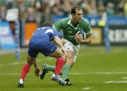 14 February 2004; Girvan Dempsey, Ireland, goes past Christophe Dominici, France. RBS 6 Nations Championship 2003-2004, France v Ireland, Stade de France, St. Denis, Paris, France. Picture credit; Matt Browne / SPORTSFILE *EDI*